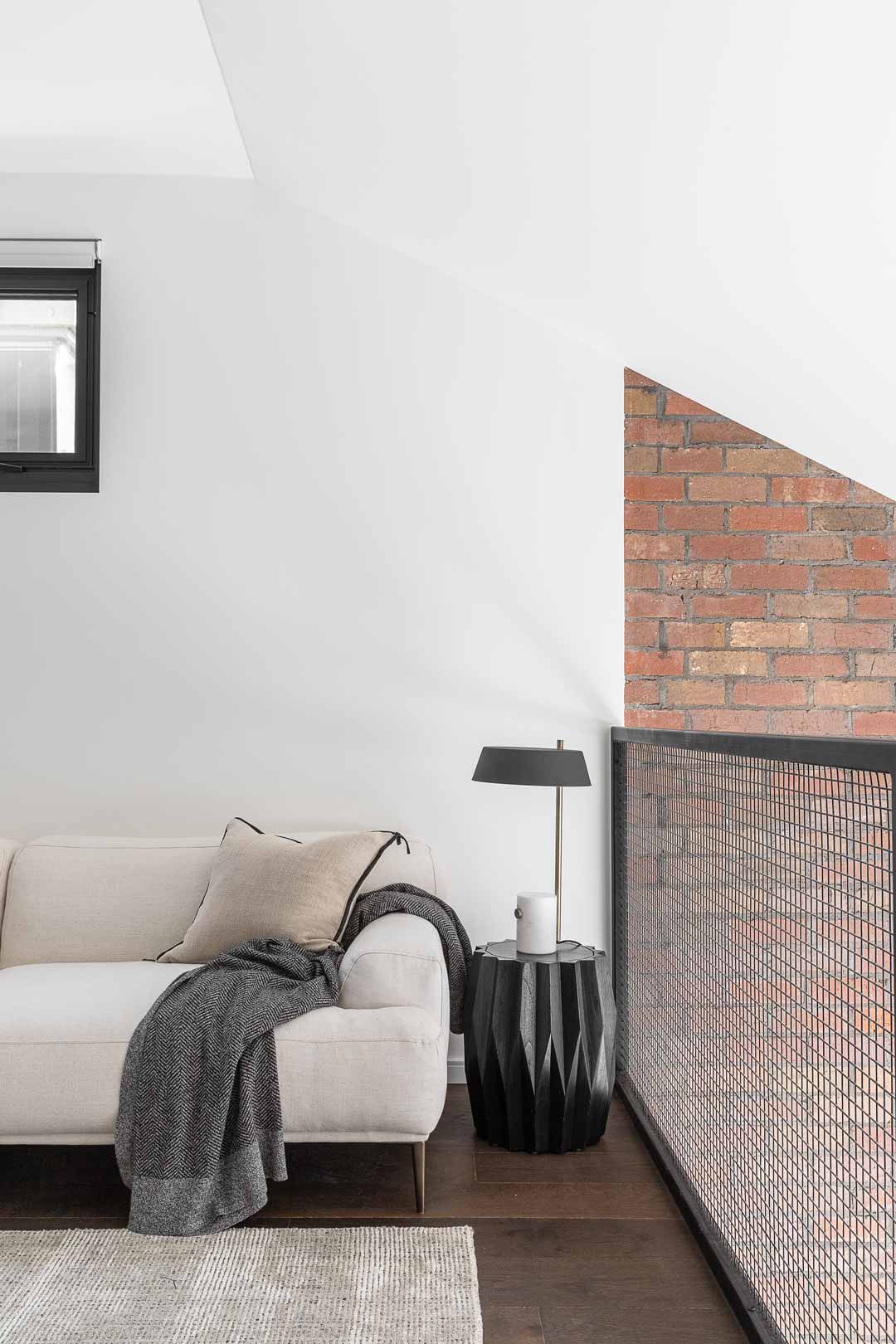 A-loft-style-mezanine-living-room-in-an-industrial-style-Melbourne-home