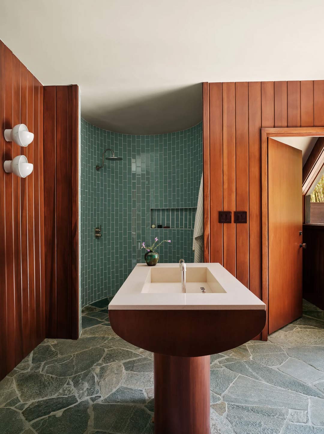 A-mid-century-inspired-bathroom-featuring-bold-blue-tiles-crazy-pave-and-warm-earthy-timber-walls