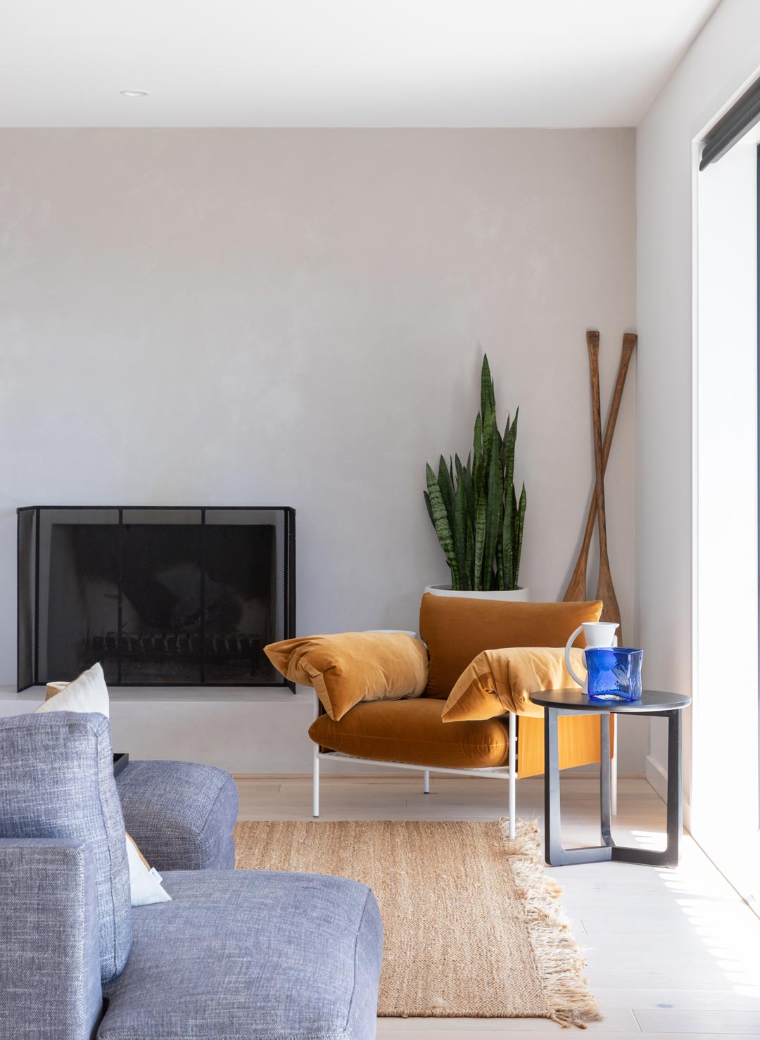 A-modern-neutral-living-room-with-a-ochre-arm-chair-for-a-pop-of-colour