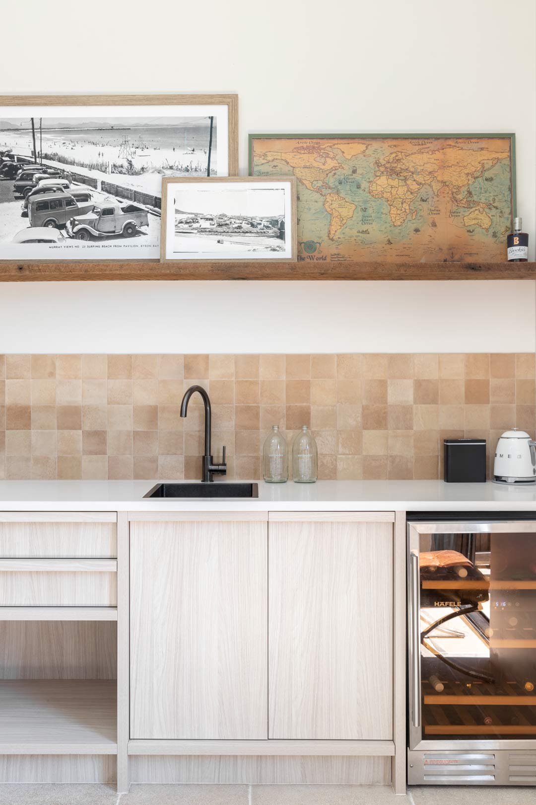 A-neutral-kitchenette-in-a-guest-studio-space-with-brushed-gunmetal-tapware