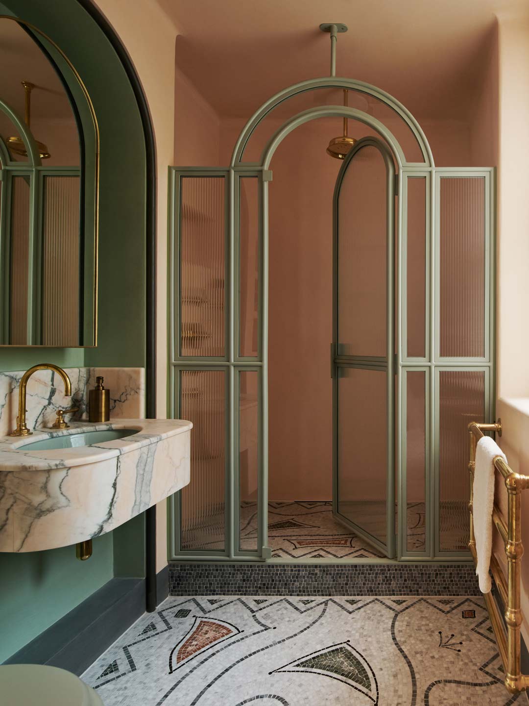 A-pink-and-green-intricate-art-deco-inspired-bathroom-with-brushed-brass-tapware