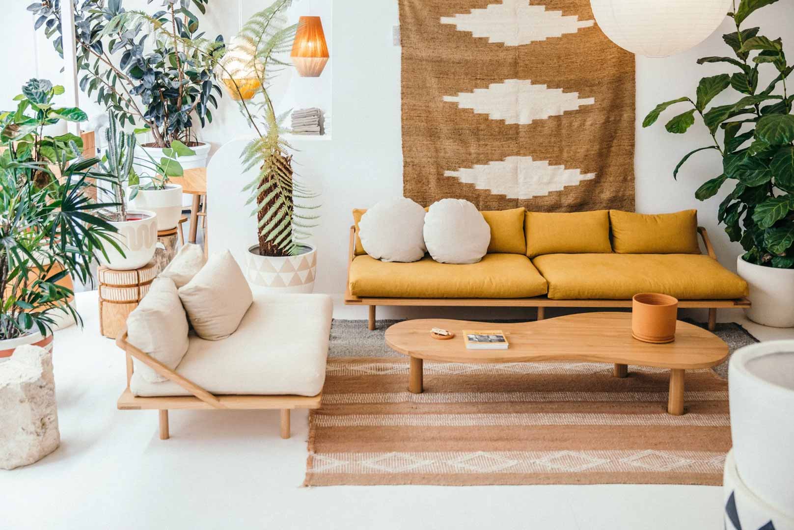 A-warm-cosy-living-room-with-a-linen-couch-and-a-mustard-linen-couch-jute-rug-and-house-plants