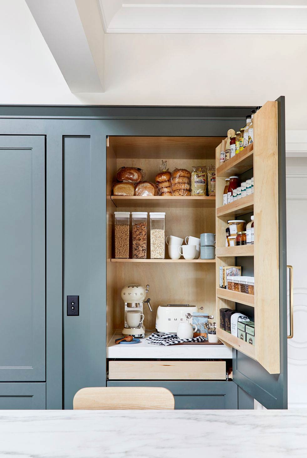 DIY-coffee-bar-cabinet-for-coffee-and-tea-bar-at-home-blue-cabintry-with-apliances-tucked-away