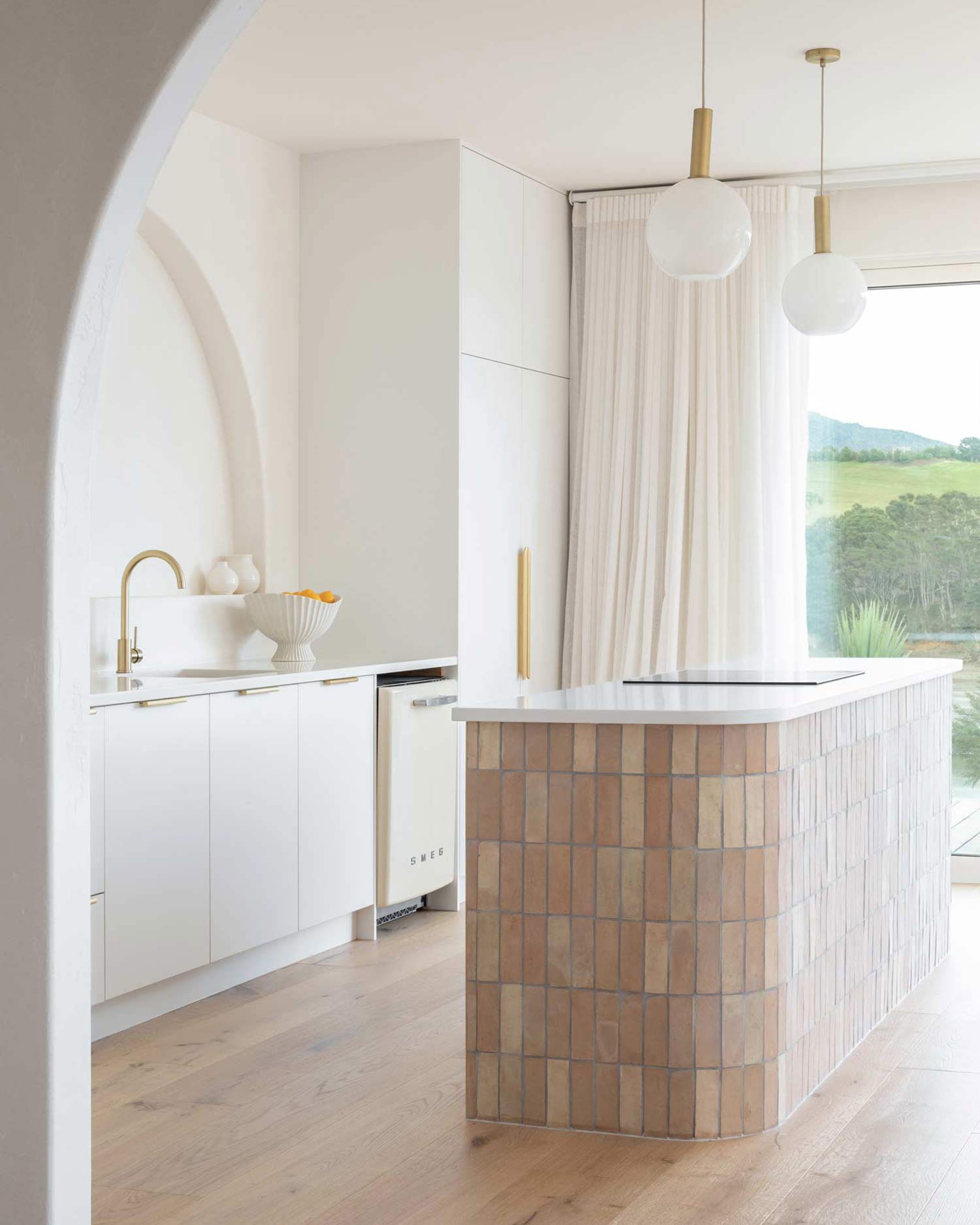 Kitchen-styling-ideas-for-a-moditerranean-home-inclue-brushed-brass-tapware-handmade-clay-tiles-niche-wall-and-a-neutral-colour-palette-2