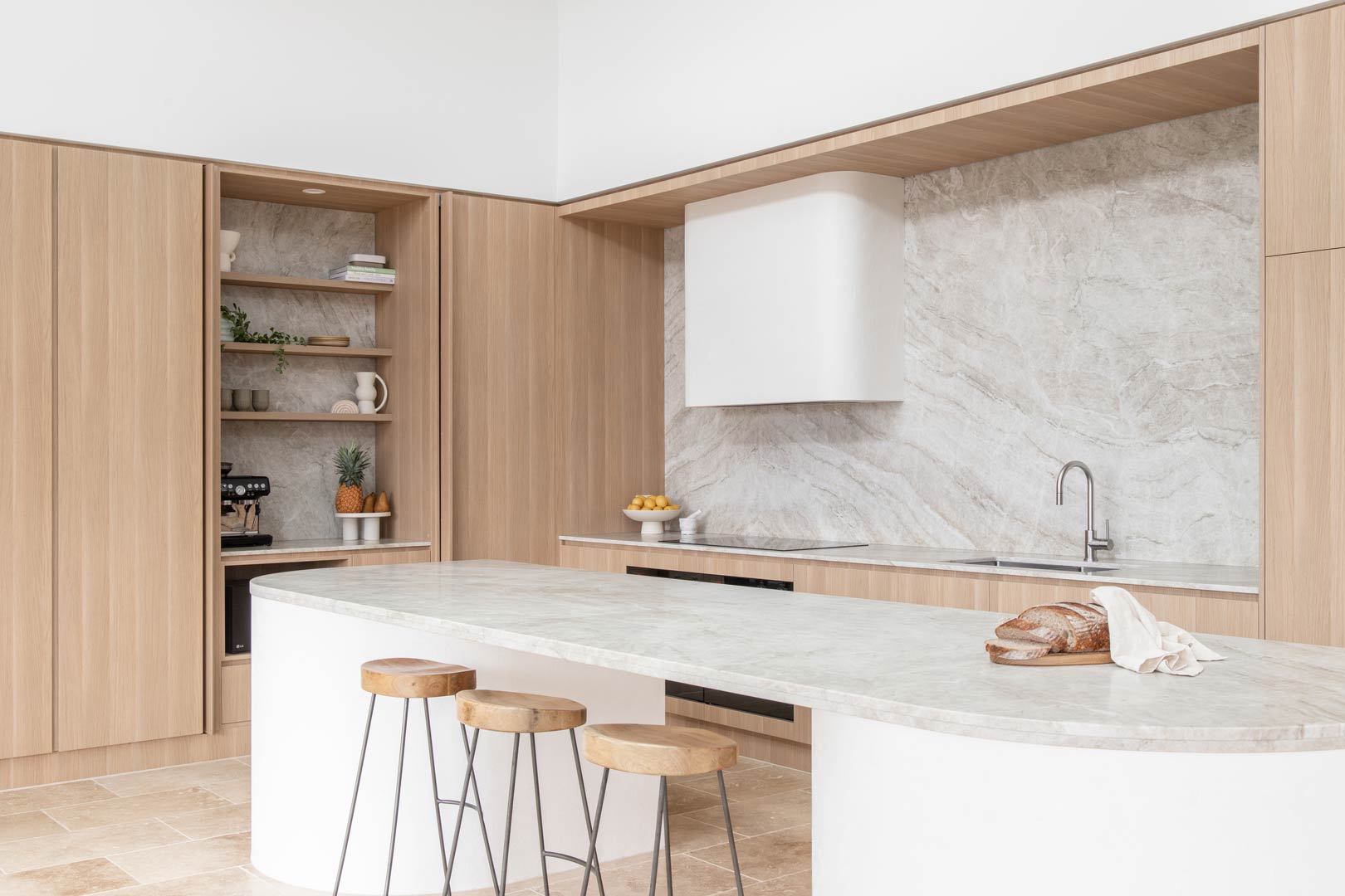 Light-bright-kitchen-with-built-in-home-coffee-bar-brushed-nickel-tap-with-stainless-steel-home-coffee-machine