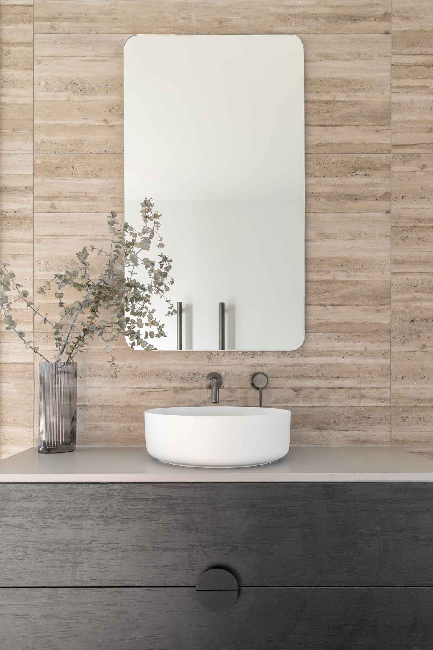 Modern-industrial-style-bathroom-features-timber-look-tiles-dark-black-vanity-cabinet-and-gun-metal-tapware