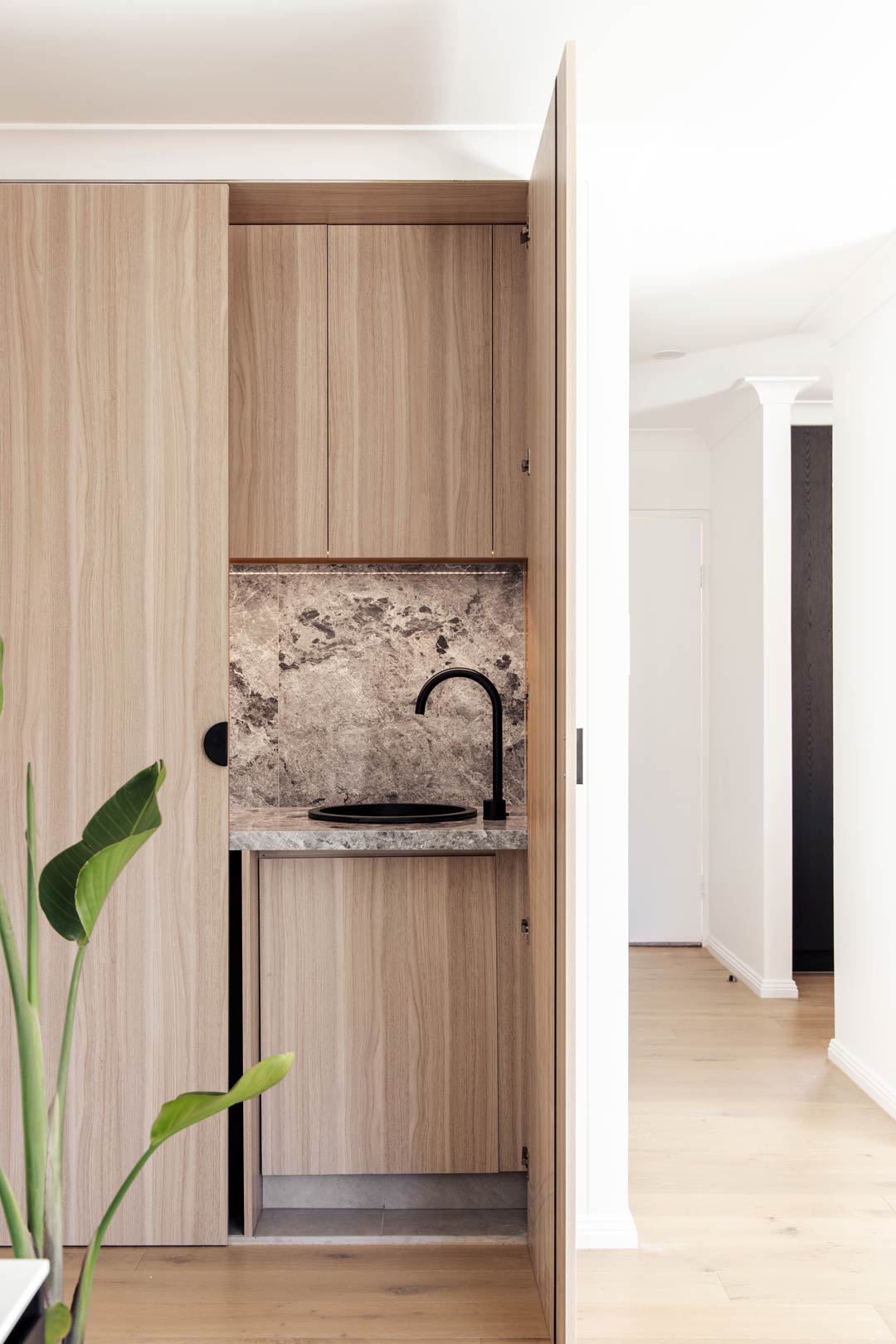 Space-saving-small-laundry-ideas-tucking-your-compact-laundry-in-a-hallway-cupboard