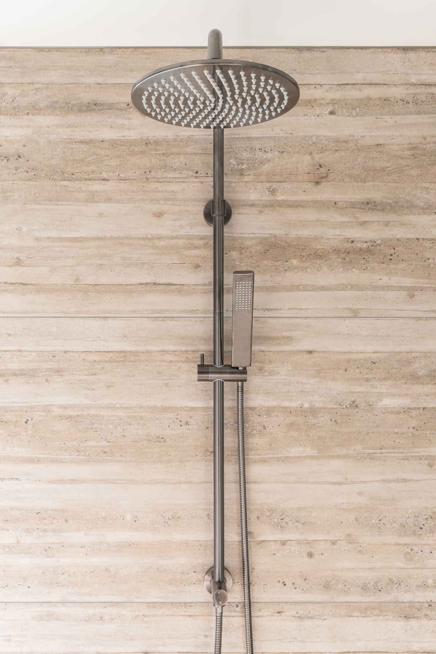 Timber-look-tiles-and-gun-metal-shower-set-in-a-contemporary-house-design
