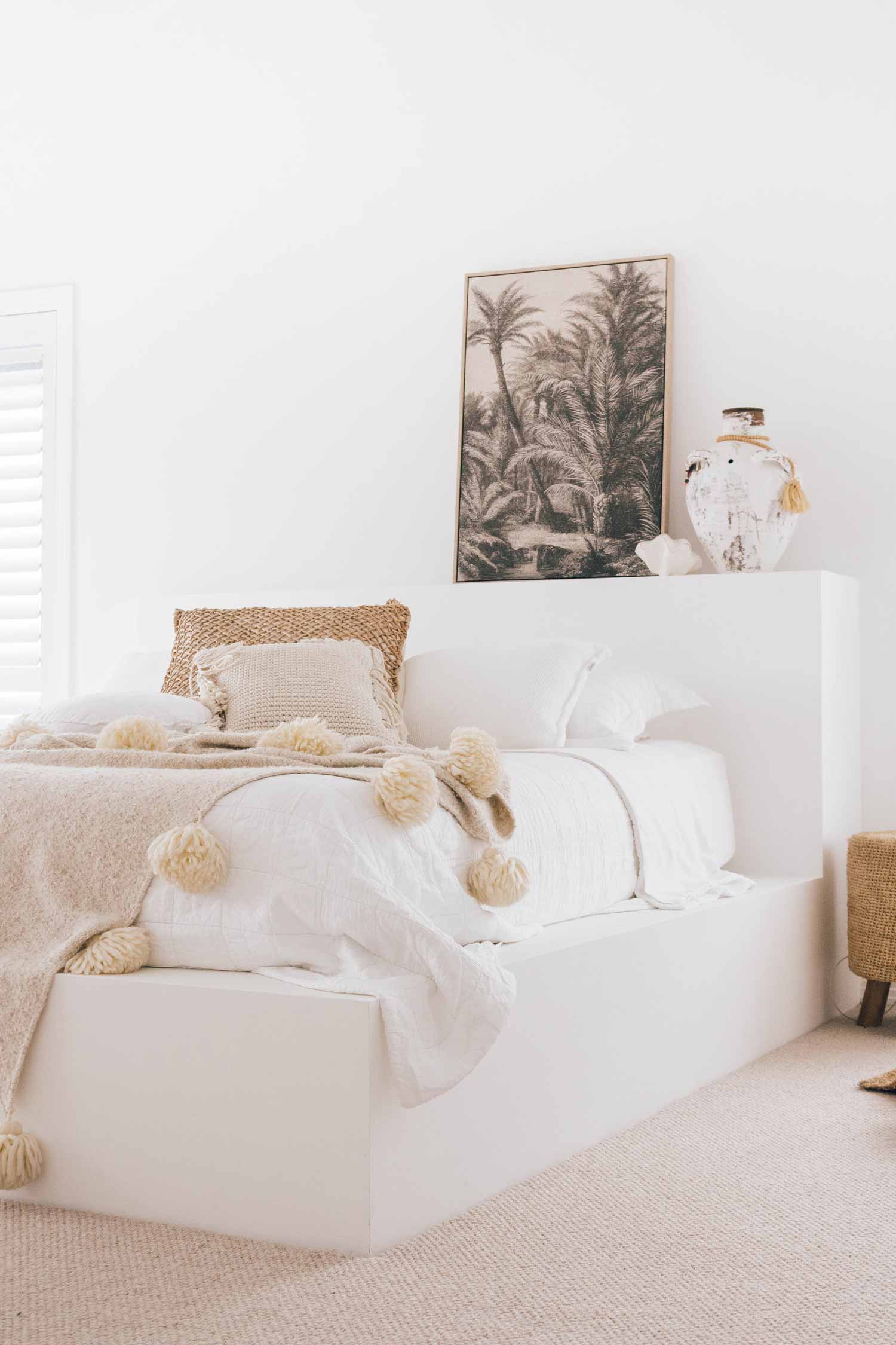 Tropical-bedroom-artwork-above-bed-in-a-light-bright-airy-coastal-home